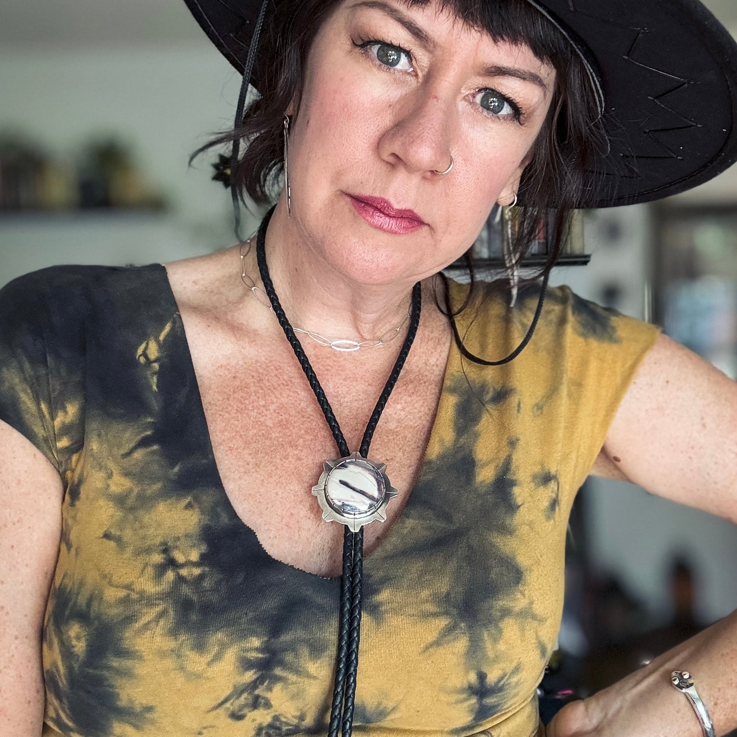 photo of a woman wearing a unique silver sci-fi jasper bolo tie