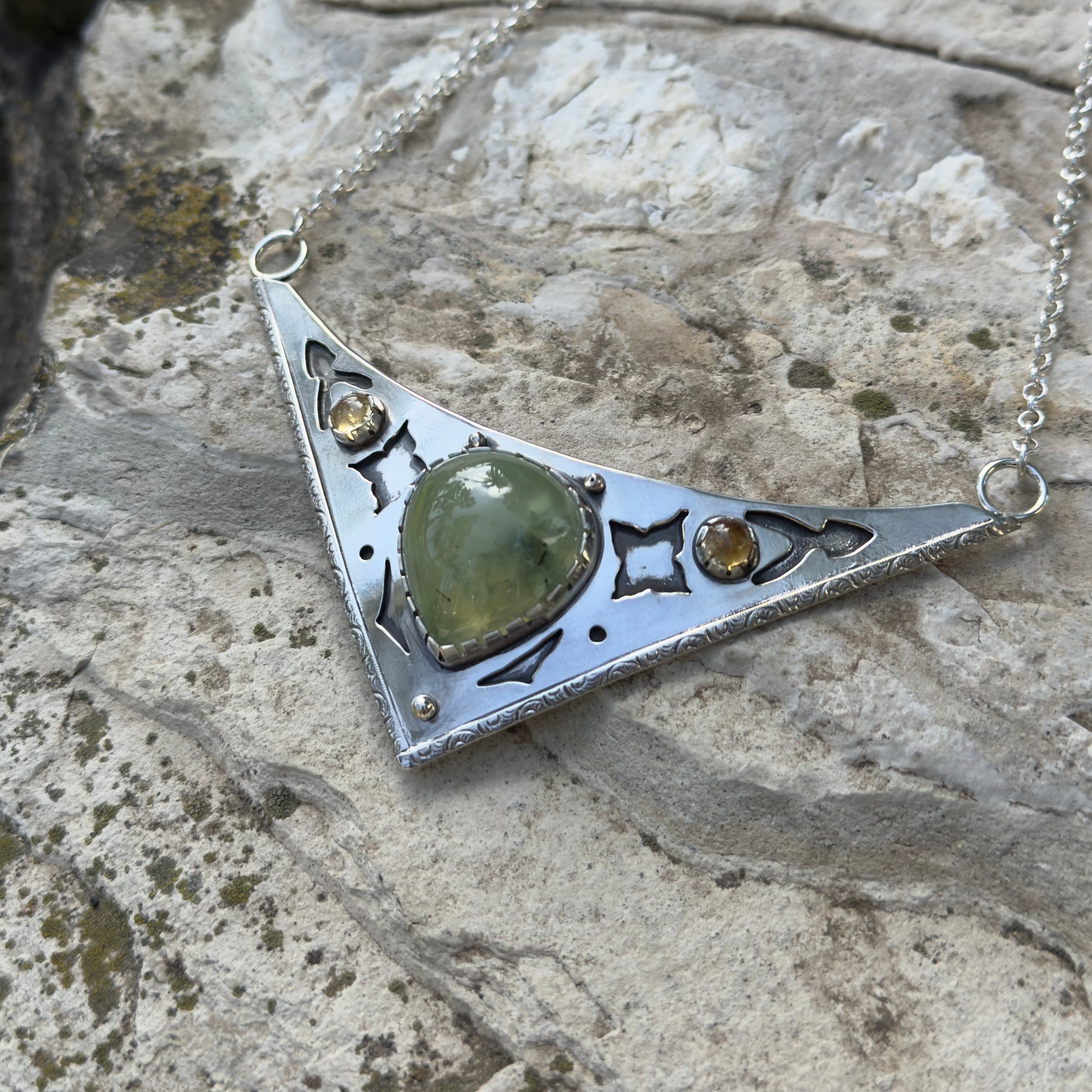 photo of an ornate silver and prehnite citrine collar necklace