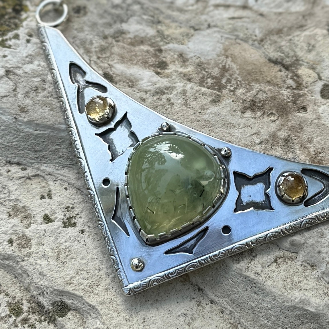 close up photo of an ornate silver and prehnite citrine collar necklace