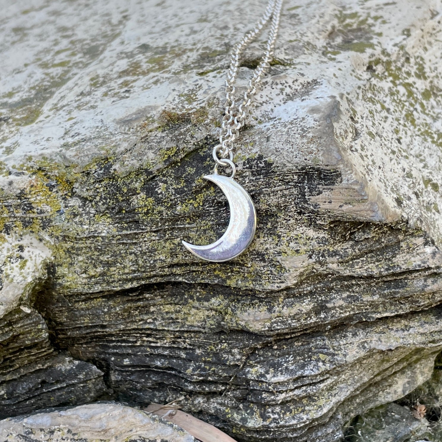 photo of a sterling crescent moon necklace