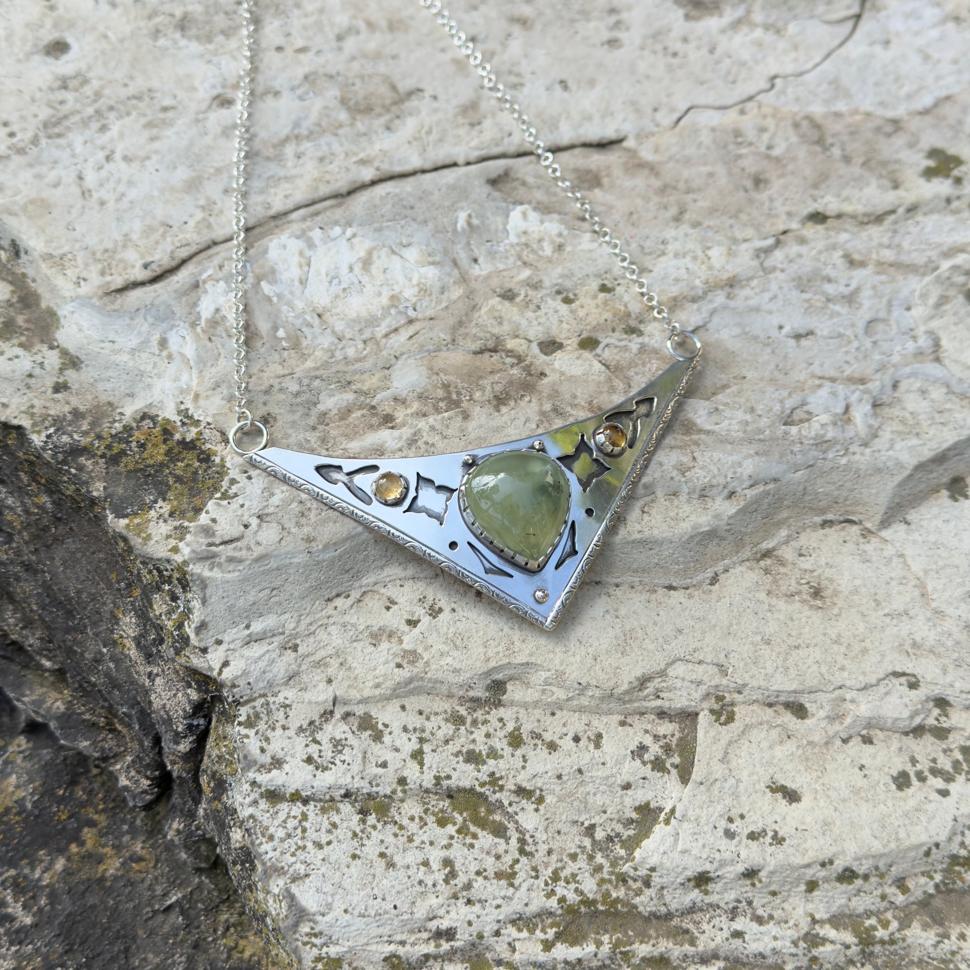 photo of an ornate silver and prehnite citrine collar necklace