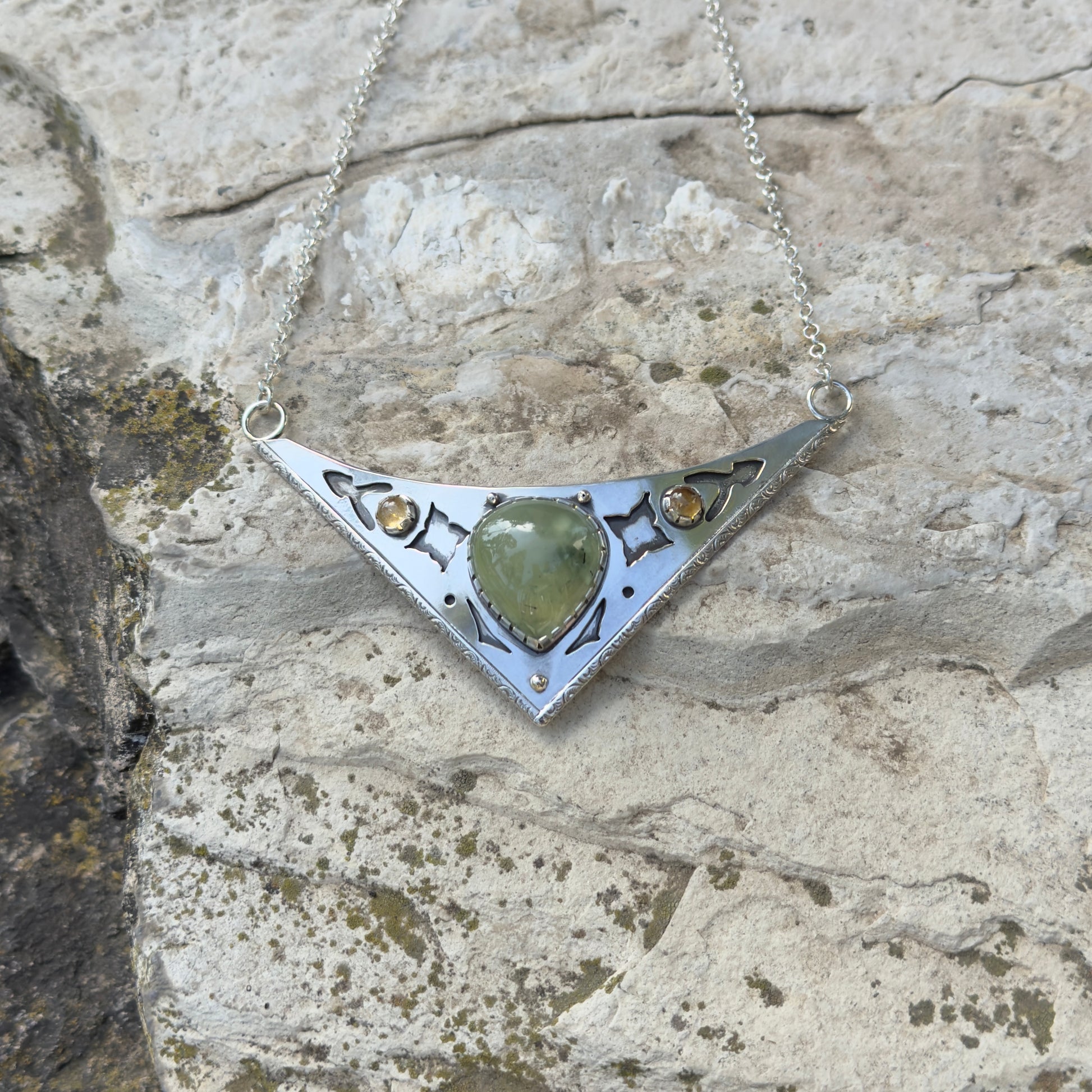 photo of an ornate silver and prehnite citrine collar necklace